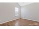 Light and bright bedroom has wood-look vinyl floors and vaulted ceiling at 1911 Kingstree Dr, Monroe, NC 28112