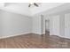 This spacious bedroom with tray ceiling has vinyl floors and neutral paint at 1911 Kingstree Dr, Monroe, NC 28112