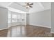 Bright main bedroom featuring hardwood floors, lots of natural light, and neutral decor at 1911 Kingstree Dr, Monroe, NC 28112