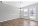 Dining area featuring hardwood floors, a chandelier, and lots of natural light at 1911 Kingstree Dr, Monroe, NC 28112