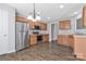 The kitchen features stainless steel appliances, wood cabinets and light countertops at 1911 Kingstree Dr, Monroe, NC 28112