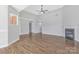 Open living room featuring hardwood floors, a fireplace, and neutral decor at 1911 Kingstree Dr, Monroe, NC 28112