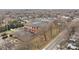 Aerial view of red brick building featuring large windows and mature trees at 201 Hoskins S Rd # 124, Charlotte, NC 28208