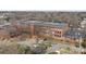 An aerial view of a brick apartment building showcasing its architectural details at 201 Hoskins S Rd # 124, Charlotte, NC 28208