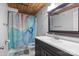 Bathroom features a modern vanity, attractive tiling, and a tub with stylish shower curtain at 201 Hoskins S Rd # 124, Charlotte, NC 28208