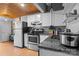 View of the kitchen with stainless steel appliances and wood ceilings at 201 Hoskins S Rd # 124, Charlotte, NC 28208