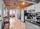 Open concept kitchen with modern appliances and wood ceilings at 201 Hoskins S Rd # 124, Charlotte, NC 28208