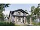 Lovely two-story home featuring stone accents, a welcoming porch and verdant landscaping at 2555A Hemphill St, Charlotte, NC 28208