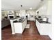 Spacious kitchen with white cabinets, a dark countertop island, and stainless steel appliances in an open layout at 269 Loch Stone St, Fort Mill, SC 29715