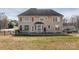 Back exterior showing a large wooden deck and windows overlooking the backyard at 3230 Creek Bend Ct, Sherrills Ford, NC 28673