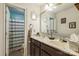 Stylish bathroom with double vanity, marble countertop, and a separate toilet room at 3230 Creek Bend Ct, Sherrills Ford, NC 28673