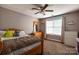 Cozy bedroom featuring neutral tones, a ceiling fan and ample natural light at 3230 Creek Bend Ct, Sherrills Ford, NC 28673