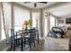 Inviting dining area featuring light-filled windows and wood-look flooring at 3230 Creek Bend Ct, Sherrills Ford, NC 28673