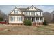 Charming two-story home featuring symmetrical design and a welcoming front porch with white pillars at 3230 Creek Bend Ct, Sherrills Ford, NC 28673