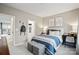 Bright bedroom with striped bedding, neutral walls, closet, and modern décor at 324 Basil Dr, Indian Trail, NC 28079