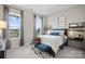 Cozy bedroom featuring large windows, providing abundant natural light and inviting ambiance at 324 Basil Dr, Indian Trail, NC 28079