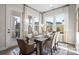 Formal dining room featuring a wood table, elegant chairs, and large windows for natural light at 324 Basil Dr, Indian Trail, NC 28079