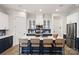 Modern kitchen with stainless steel appliances, center island, and stylish backsplash at 324 Basil Dr, Indian Trail, NC 28079