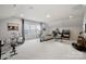 Bright and spacious upstairs living room offers versatile living, with instruments and musical decor at 324 Basil Dr, Indian Trail, NC 28079