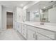 Luxurious bathroom featuring dual sinks, quartz countertops, and a glass-enclosed shower at 4011 Vista Pine Dr, Charlotte, NC 28215