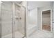 Modern bathroom boasts a sleek shower, a soaking tub, and elegant finishes at 4011 Vista Pine Dr, Charlotte, NC 28215