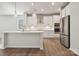 Modern kitchen featuring stainless steel appliances, a center island with a sink, and ample counter space at 4011 Vista Pine Dr, Charlotte, NC 28215