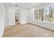 Bright bedroom featuring wood floors, large windows with a lake view at 4069 Rivendell Rd # 5, Denver, NC 28037