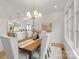 Elegant dining room featuring a chandelier, large windows, and seating for eight at 4069 Rivendell Rd # 5, Denver, NC 28037