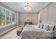 Luxurious main bedroom with beautiful light fixture, large windows and paneled walls at 4069 Rivendell Rd # 5, Denver, NC 28037