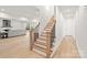 Bright home interior showcasing a staircase with natural wood treads and black metal spindles at 4069 Rivendell Rd # 5, Denver, NC 28037