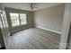 This bedroom has a ceiling fan, good light, and contemporary flooring at 4904 Cornelia Dr, Charlotte, NC 28269