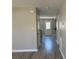 A hallway with a view of the back door and wood-look floors at 4904 Cornelia Dr, Charlotte, NC 28269