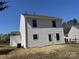 Rear exterior of home showing vinyl siding with a small patio area at 4904 Cornelia Dr, Charlotte, NC 28269