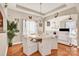 Bright dining room featuring a tray ceiling, a chandelier, and hardwood flooring at 541 Settlers Grove Ln # 49, Salisbury, NC 28146