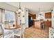 Well-lit kitchen and breakfast nook featuring black appliances and bright eating area at 541 Settlers Grove Ln # 49, Salisbury, NC 28146