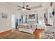 Spacious main bedroom with a tray ceiling, fan, and wood flooring at 541 Settlers Grove Ln # 49, Salisbury, NC 28146