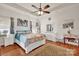 Bright main bedroom with tray ceiling, fan, and wood floors providing a serene atmosphere at 541 Settlers Grove Ln # 49, Salisbury, NC 28146