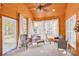 Relaxing sunroom features wood walls, lots of windows and comfy seating at 541 Settlers Grove Ln # 49, Salisbury, NC 28146