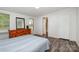 Cozy bedroom with wood-look flooring, a dresser, and a bright window at 6106 Ashley Dr, Concord, NC 28025