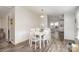 Bright dining area with access to the kitchen featuring a white table and stylish chairs at 6106 Ashley Dr, Concord, NC 28025