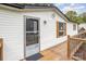 Home's exterior featuring deck, storm door, window with shutters, and siding at 6106 Ashley Dr, Concord, NC 28025