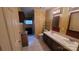 Well-lit bathroom featuring dual sinks, tile floors, and dark wood cabinets at 618 Camp Rotary Rd, Gastonia, NC 28052