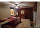 Cozy bedroom features carpet flooring, a ceiling fan, and natural light at 618 Camp Rotary Rd, Gastonia, NC 28052