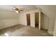 Bedroom featuring a ceiling fan, neutral walls, carpet flooring, and closet at 618 Camp Rotary Rd, Gastonia, NC 28052