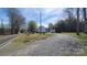 View of the home's exterior, showing the driveway and surrounding landscape at 618 Camp Rotary Rd, Gastonia, NC 28052