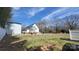 View of the home's exterior featuring white siding and a metal roof at 618 Camp Rotary Rd, Gastonia, NC 28052