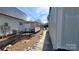 View of the home's side yard with a ramp and metal shed at 618 Camp Rotary Rd, Gastonia, NC 28052