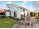 Charming backyard featuring a well-maintained lawn, stepping stones, and blue-striped awning at 657 Heathridge Rd, Rock Hill, SC 29732