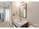 A bathroom sink area with a framed mirror at 657 Heathridge Rd, Rock Hill, SC 29732