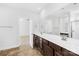 Bathroom featuring double sinks, a large mirror, and access to bedroom and shower at 7314 Rupell Dr, Charlotte, NC 28273